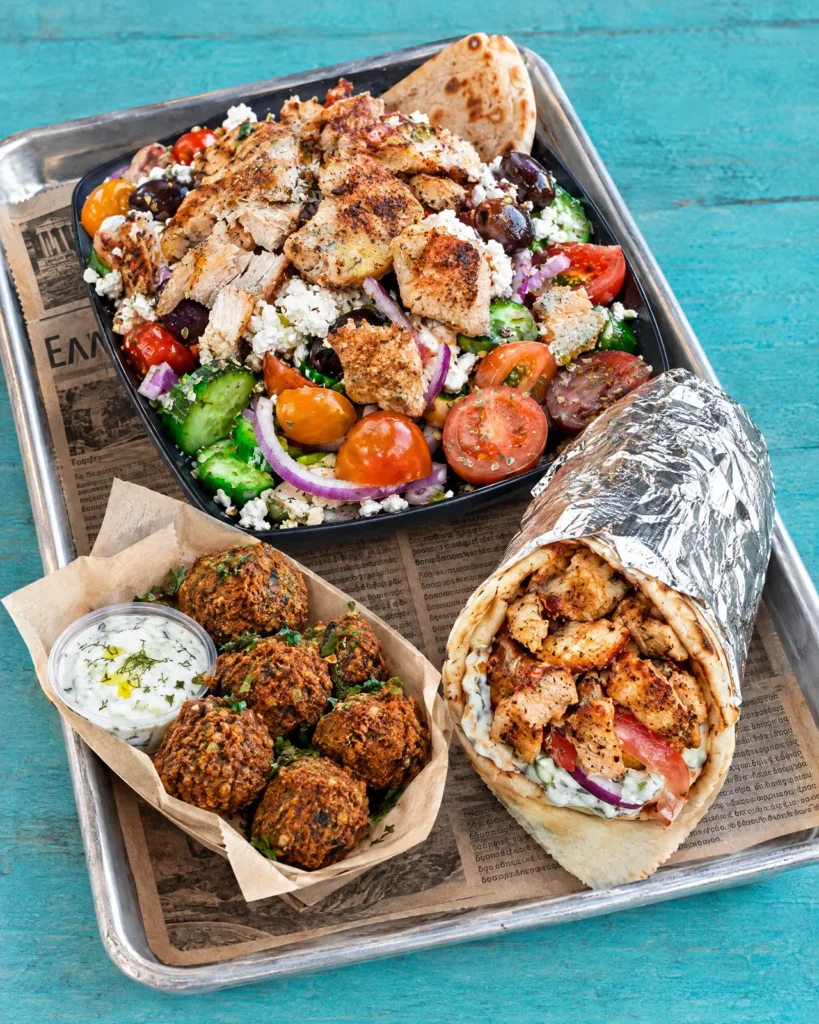 Gyro in pita, Greek salad with gyro on top and falafel from Kalamaki Greek LA